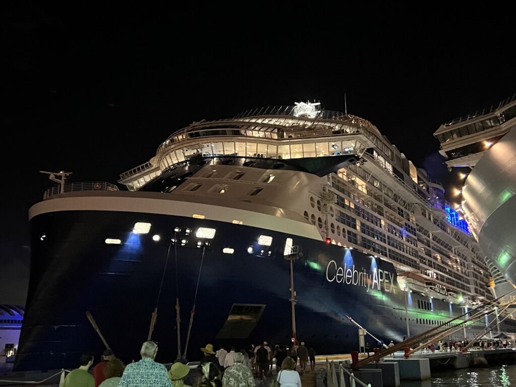 Celebrity Apex Cruise Ship lit up at night