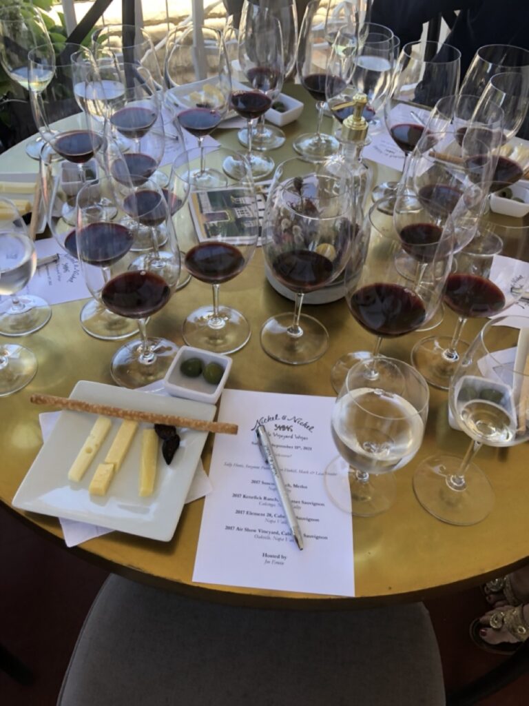 A table set with dozens of wine glasses, a wine tasting at Nickel & Nickel Napa California