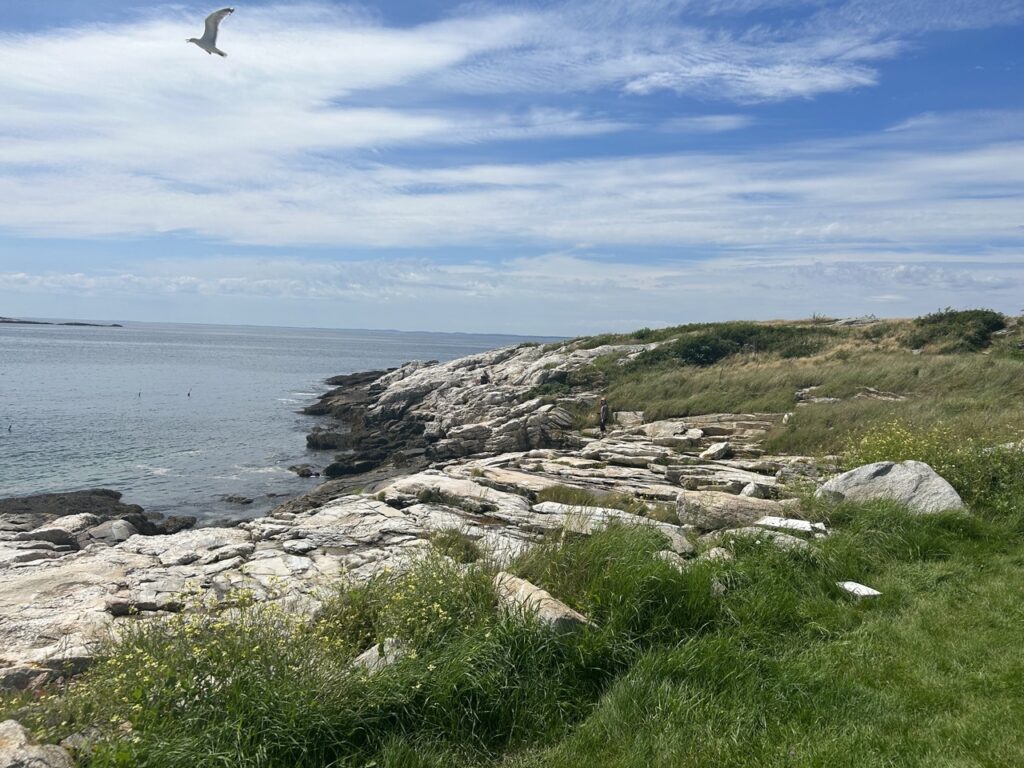 Rocky Coastline and view of the Atlantic ocean off Star Island one of the Isles of Shoals in New Hampshire. - a destination to visit in New Hampshire