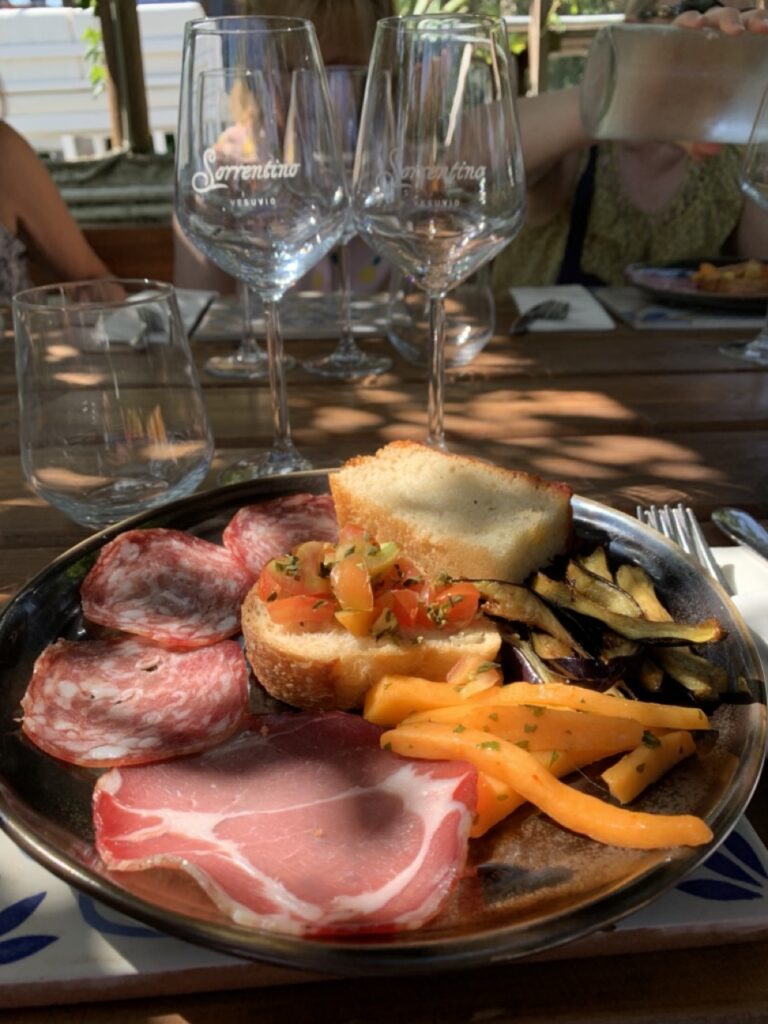 Wine tasting in Sorrentino - wine glasses with meat, bread, peppers