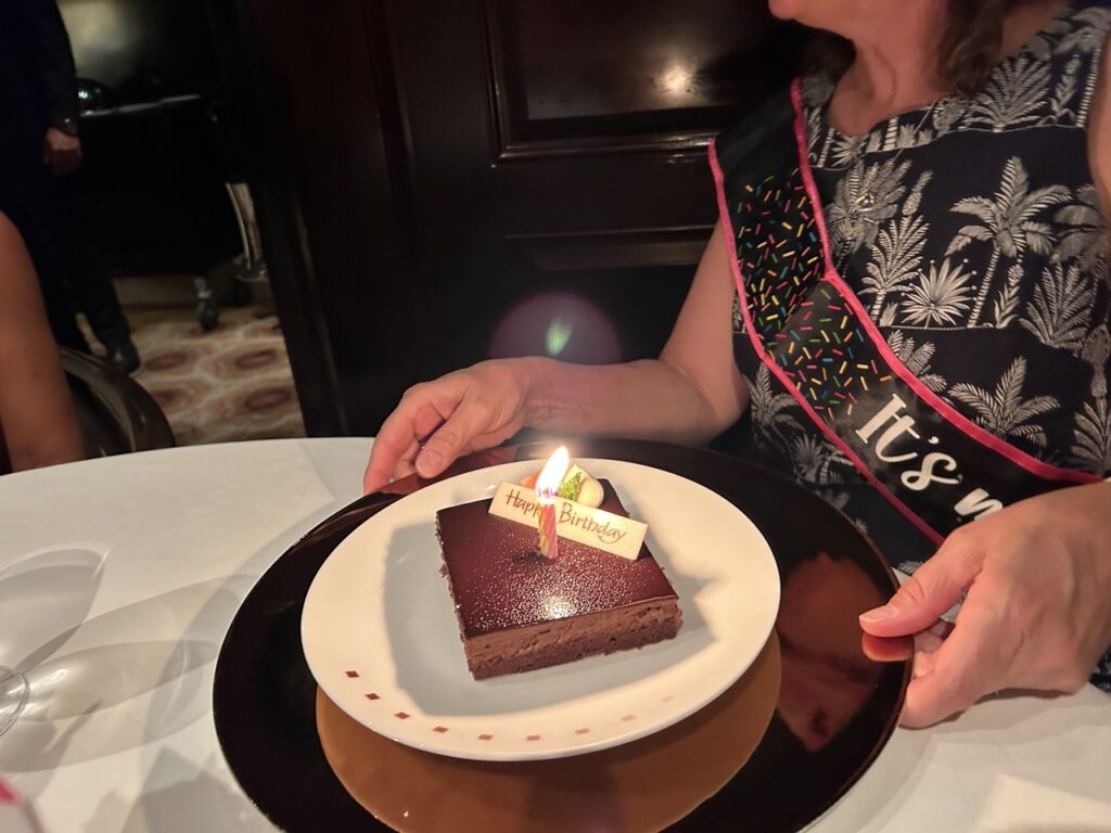 Specialty dining on a cruise for a birthday - with a cake and candles. - tip planning for a girls trip cruise!