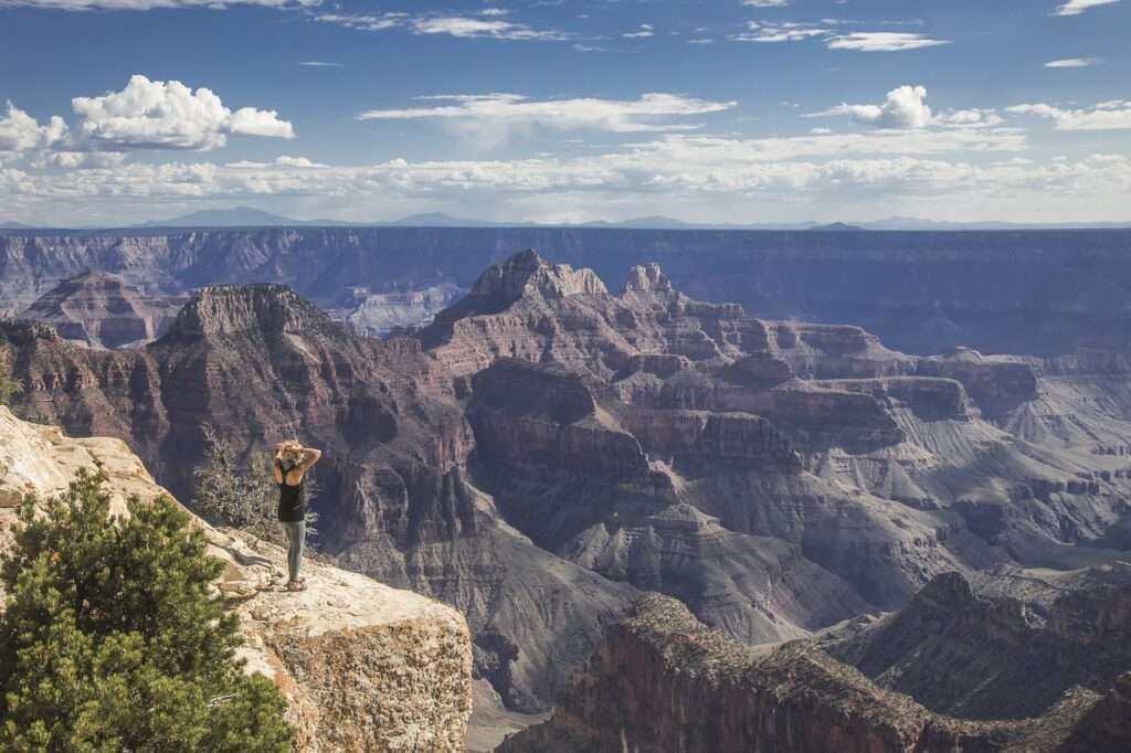 A woman looking over the Grand Canyon, Arizona, USA
