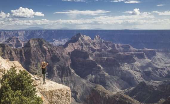 A woman looking over the Grand Canyon, Arizona, USA