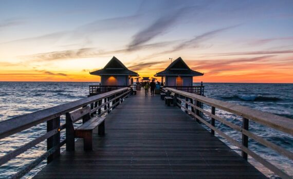 A pier in Naples Florida at sunset
