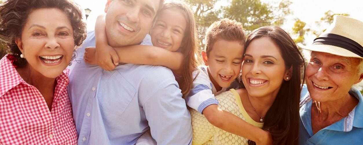 A multi--generational family, mother, father, daughter son and grandmother, grandfather