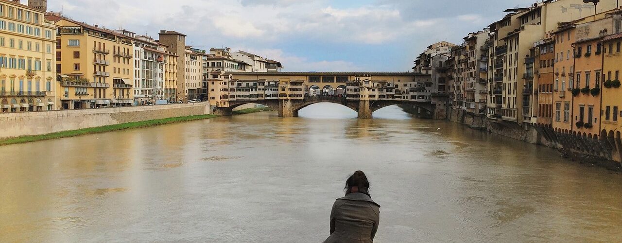 Solo traveler looking out at Florence Italy