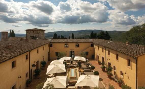 Courtyard of the Castello di Casole a Belmond property in Tuscony Italy - has Belmond Bellini Club Benefits