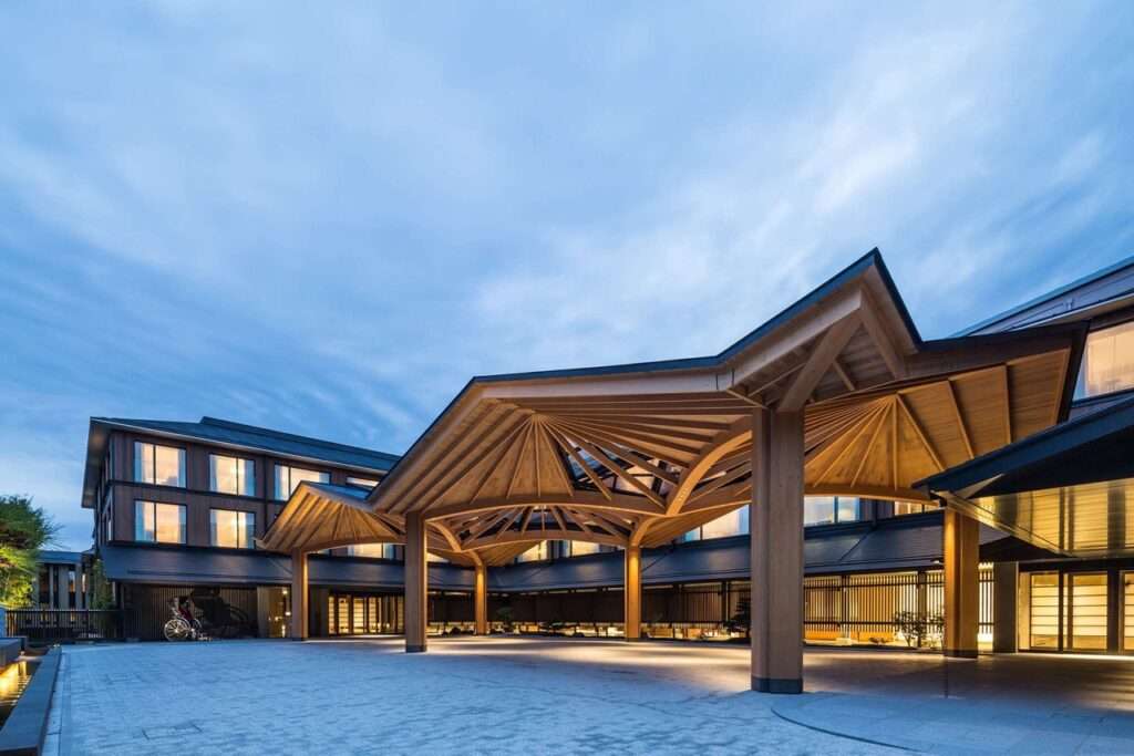 Entrance of Four Seasons Hotel in Kyoto lit up at dusk