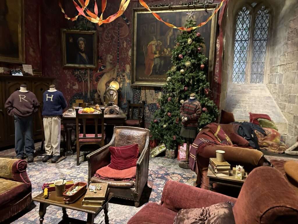 The set for the Gryffendor Common room at Hogwarts - decorated for Christmas - has two dummies dressed up as Harry and Ron in there ugly Christmas sweaters - part of the Harry Potter Experience at Warner Brothers