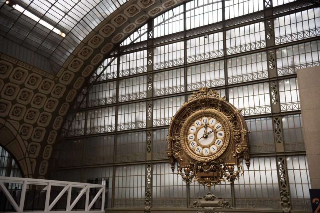 Musee D'Orsay - the large Clock. The museum is inside an old railroad station with a glass roof