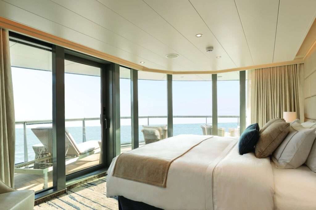 A suite with a view of the ocean and a large balcony - on a Silversea cruise ship