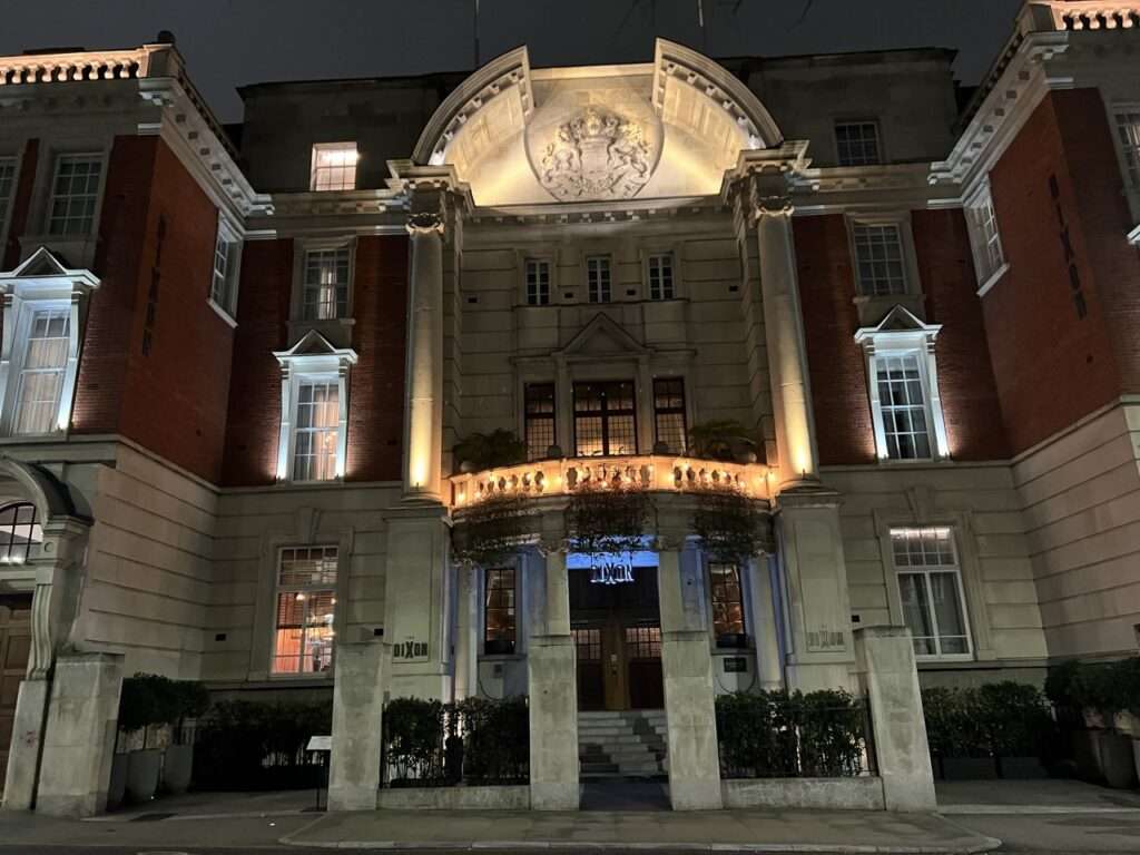 Entrance to the Dixon Tower Bridge Hotel - lit up at night