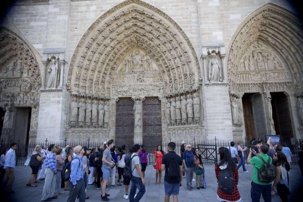 The intricately carved arched entrances to the Notre Dame, Paris