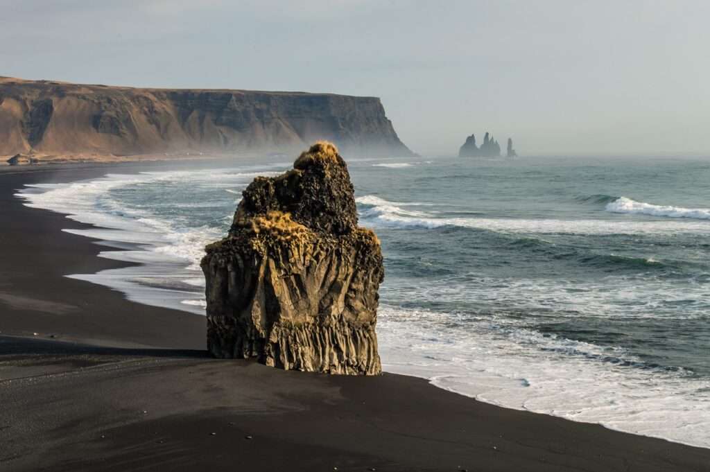 black sandy beach at reynisfjara in iceland - a perfect day trip from Reykjavik