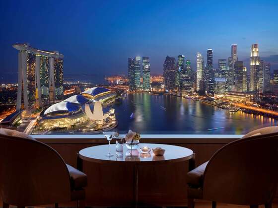 View from a room at the Ritz-Carlton Singapore - overlooking the marina and city sky line lit up a night
