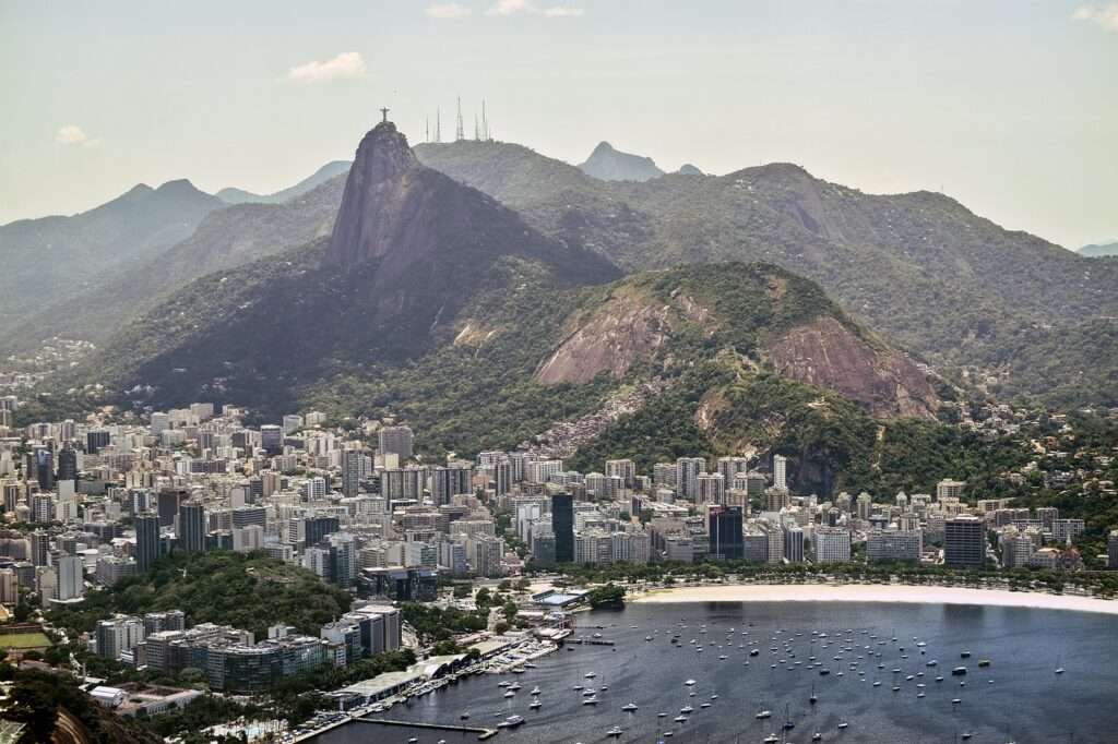 Aerial view of the city of Rio De Janeiro with views of the mountains behind it