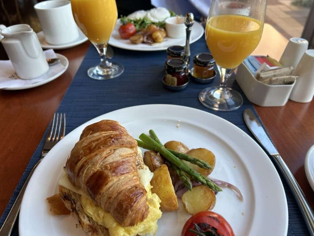 Rowes Wharf Sea Grille Breakfast - a croissant with scrambled eggs and orange juice