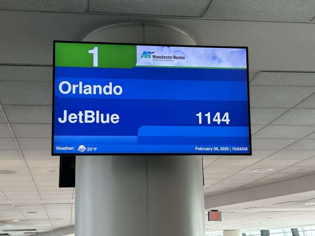 Baggage claim sign for a flight from Orlando