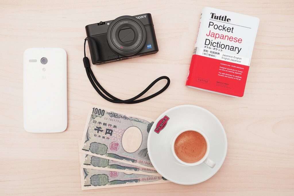 Essentials to pack for a visit to Japan: Yen, translation book, smart phone, camera - things to pack for your trip to Japan