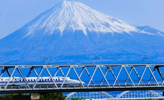 Bullet train in Japan passing Mount Fuji