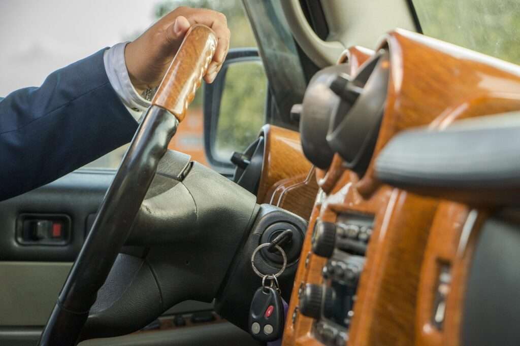 Limo driver in luxury car