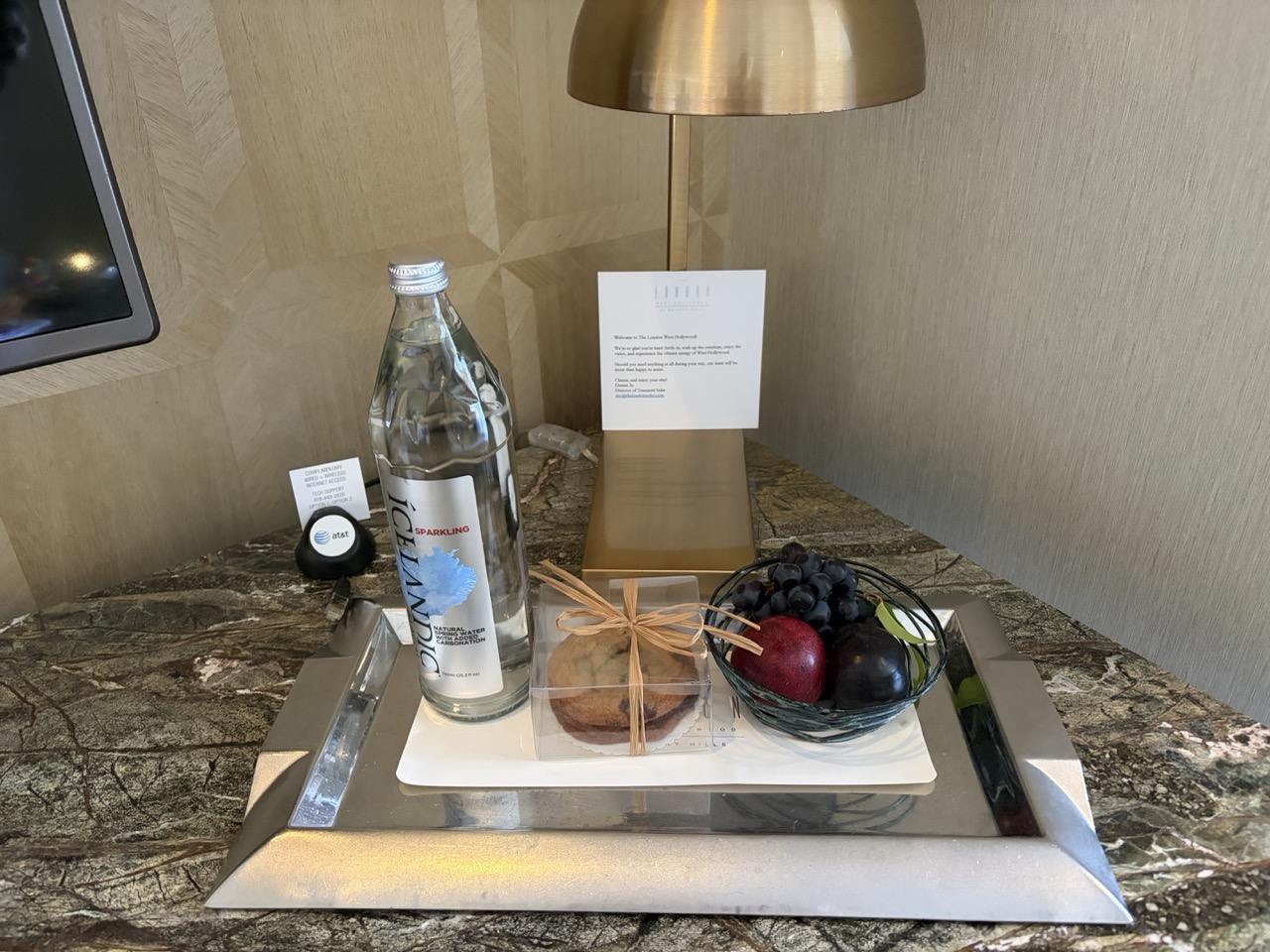 Welcome Amenity at the London West Hollywood a bowl of fruit, sparkling water, chocolate chip cookies
